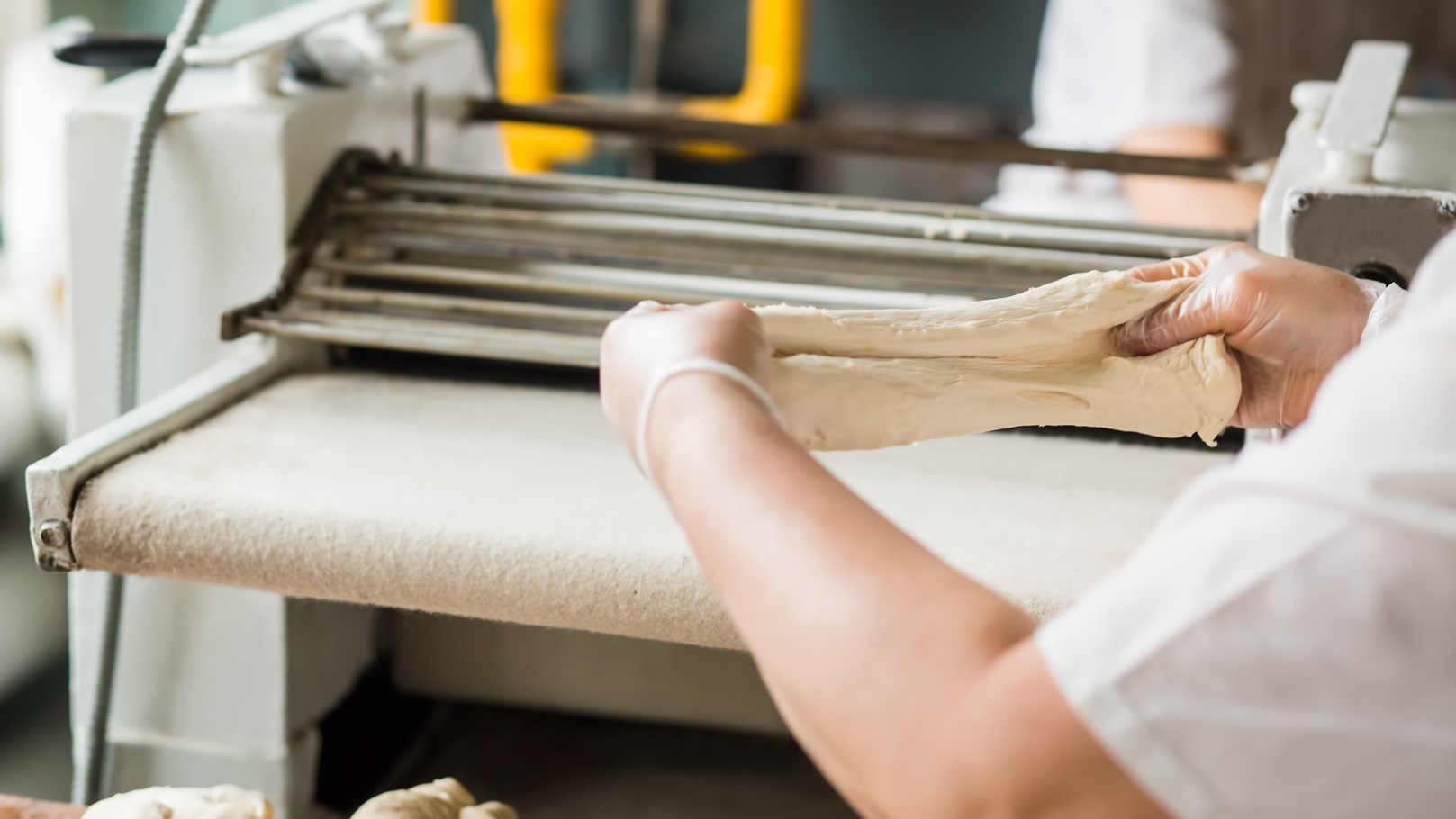 woman-baker-working-with-dough-at-the-bakery-2021-09-02-15-12-48-utc