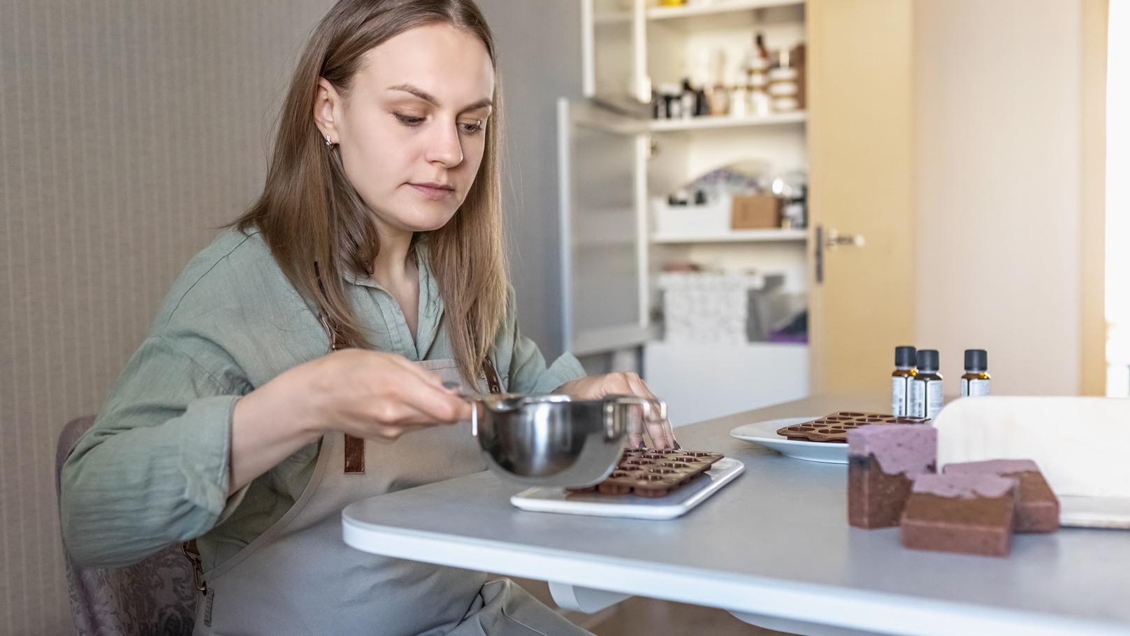 soap-maker-a-woman-pours-hot-organic-cocoa-butter-2022-03-04-15-18-40-utc