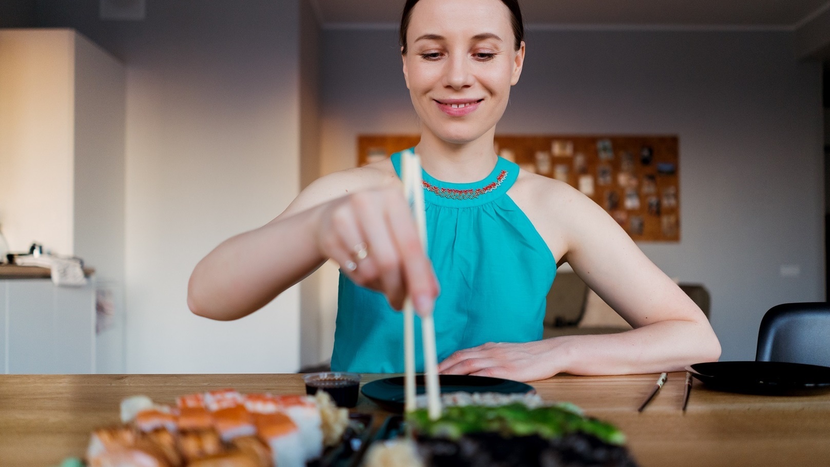 happy-woman-eating-delicious-sushi-2021-08-28-21-34-56-utc