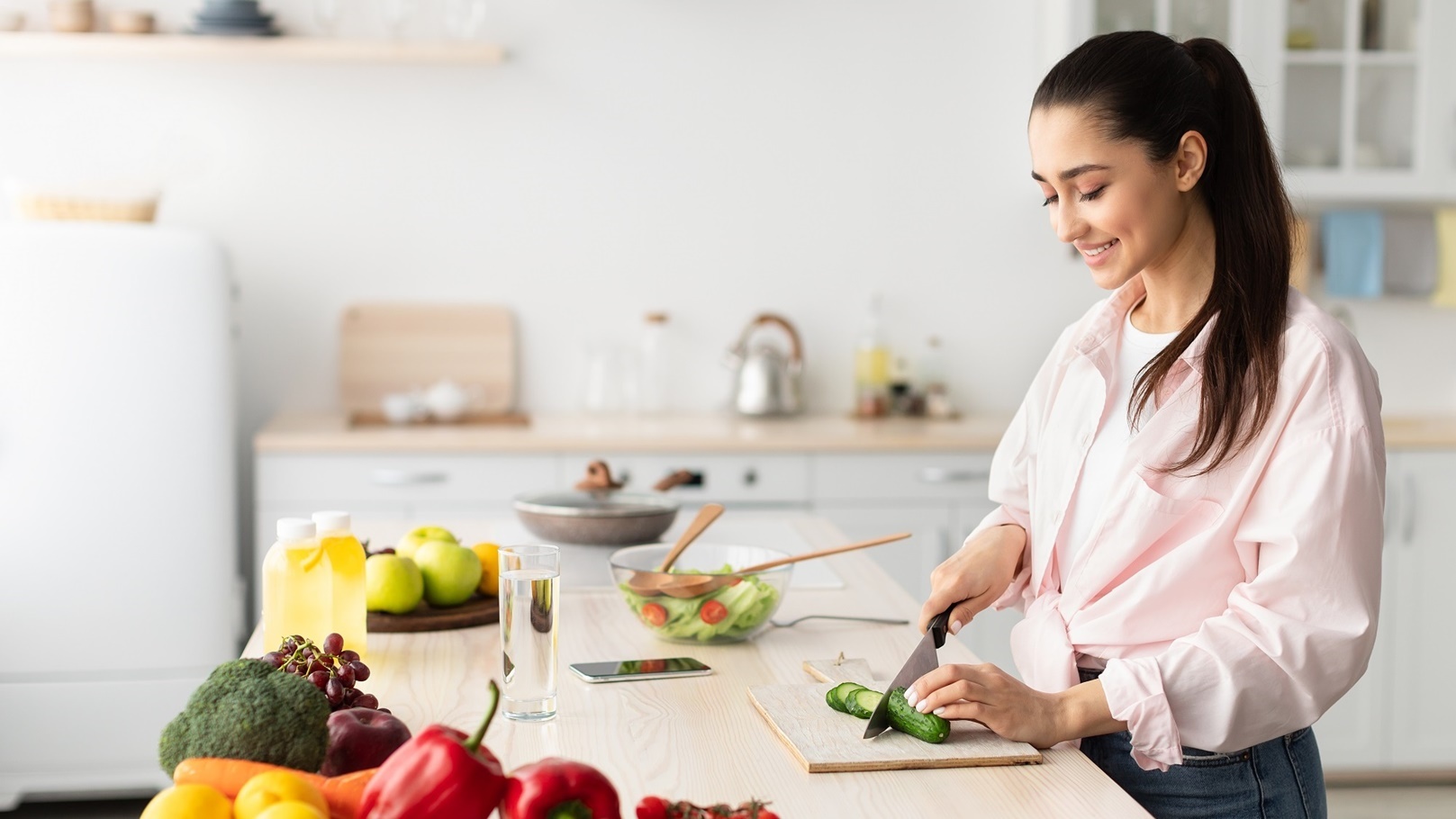 portrait-of-smiling-young-lady-cooking-fresh-salad-2021-09-03-15-22-59-utc