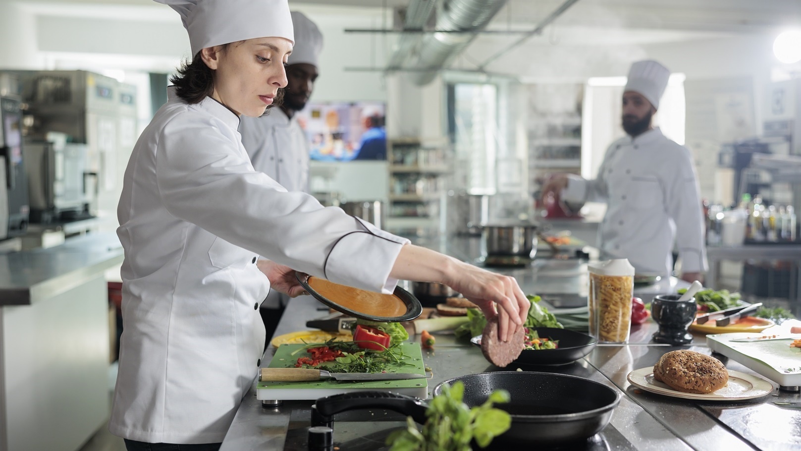 food-industry-worker-cooking-beef-patty-in-pan-whi-2022-03-30-14-51-31-utc