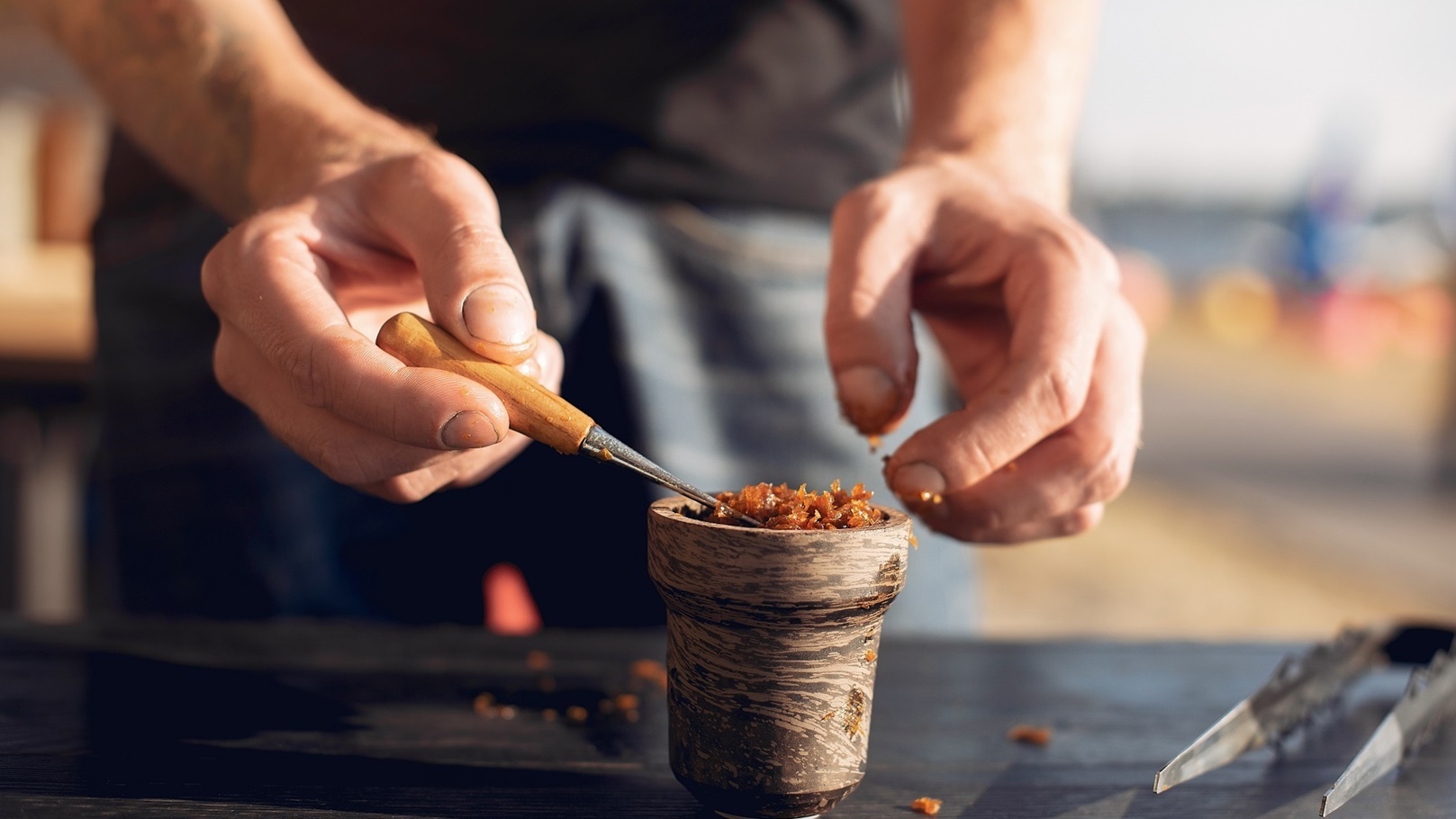 cropped-view-of-preparing-tobacco-for-shisha-on-ta-2021-08-27-11-29-48-utc